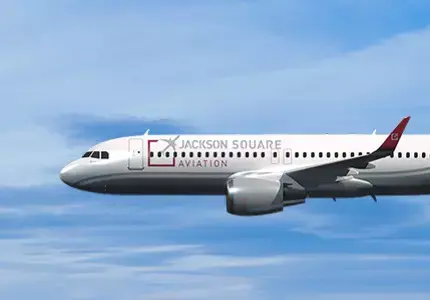 A side profile of a commerial jetliner in flight.